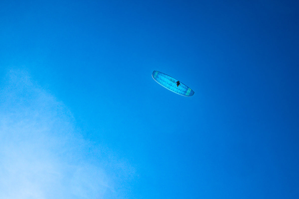 Into the blue with a paraglider